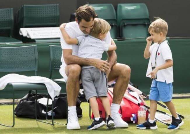 Myla Rose Federer's father, Roger Federer, with her twin brothers.